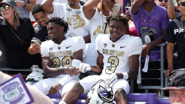 Colorado Buffaloes safety Rodrick Ward (29) and running back Dylan Edwards (3) celebrate with fans after the game against the TCU Horned Frogs at Amon G. Carter Stadium